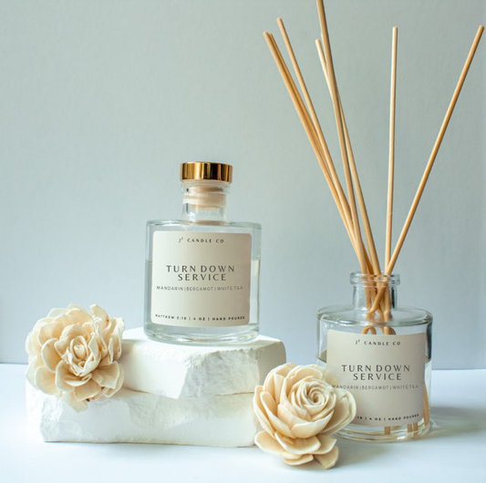 Two diffusers labeled 'Turn Down Service' with decorative flowers on a light background